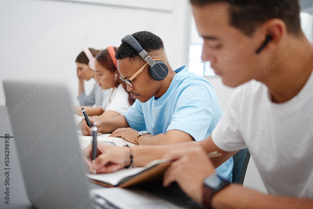 Poster Student at university study, writing and research for a exam or project with headphones for podcast or music. College, school or education black man learning, scholarship and studying in campus hall