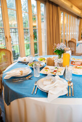 Banquet in the restaurant, serving tables, appetizers, sets