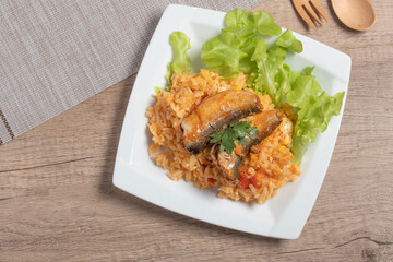 Fried rice with canned fish in a white plate.Thai food