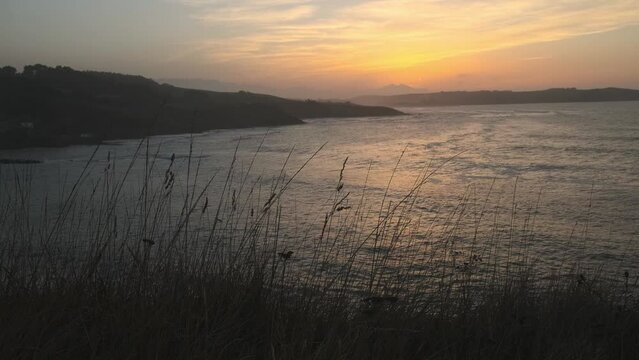 Static Shot Of Peaceful Seascape At sunset Time, Comillas Coast, Spain
