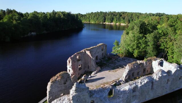 Scenic drone shot of Koknese castle ruins next to river Daugava, Latvia