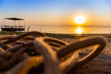 sunset by the river with boat