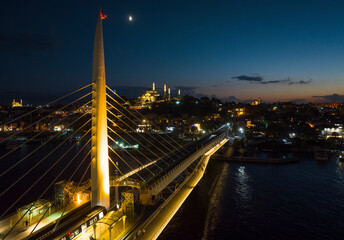 Fototapeta na wymiar Halic Metro Bridge in the Sunset Drone Photo, Galata Beyoglu, Istanbul Turkey