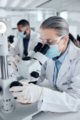 Innovation, covid and scientist woman with microscope and ppe for science research development or...