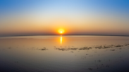 Fototapeta premium sunset on the riverbank drone