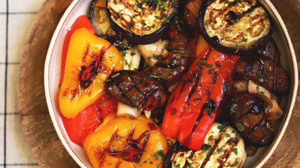 Grilled vegetables on a plate. Healthy food. Appetizing grilled peppers, eggplant, mushrooms.