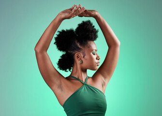Black woman, fashion and dance model pose of a person from Jamaica confident. Beauty and female empowerment of a salsa dancing and posing dancer with confidence in a studio with a green background