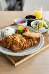 Breaded pork chop with rice