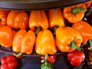 Bell peppers on a shelf in reach in cooler