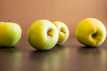 bunch of green apples at the kitchen table close up