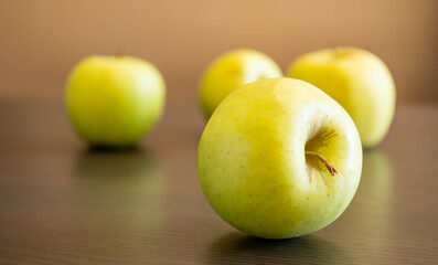 bunch of green apples at the kitchen table close up
