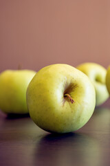 bunch of green apples at the kitchen table close up