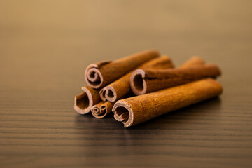 cinnamon sticks close up on dark background