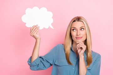 Photo of optimistic satisfied woman with straight hairdo wear blue blouse hold white cloud finger chin isolated on pink color background