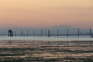 The Egawa coast of the evening, scenery of the telephone pole standing on the sea, Chiba, Japan
