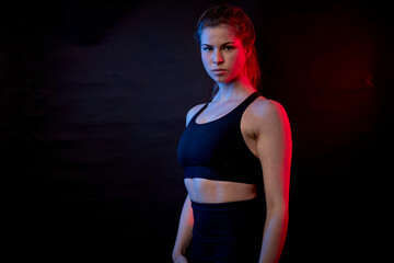 Fototapeta na wymiar fit young woman in studio posing