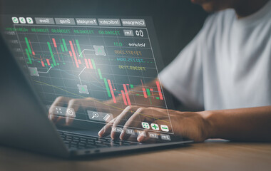 Close up investors or traders display stock graph on virtual laptop screen. financial technology...
