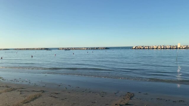 Gabicce, Pesaro Urbino, Italy. Sand, sea and rocks at the evening.  Concept for summer, beach, Italy, nature, fun, holydays, relax