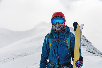 Young man on a ski vacation in the mountains, portrait. Great rider holiday in ski resort