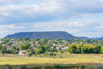 The big slagheap with the green village on the foreground.