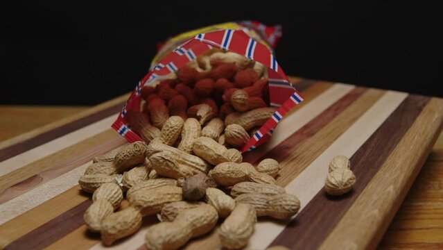 bag of peanuts spinning on a cutting board