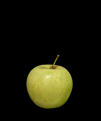  ripe green apple on a black background.