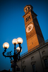 Fototapeta na wymiar The Torre dei Lamberti clock tower in Verona