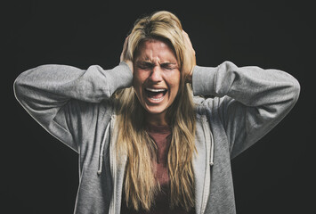 Anxiety, bipolar woman crying, frustrated or crazy on a dark studio for psychology and mental...