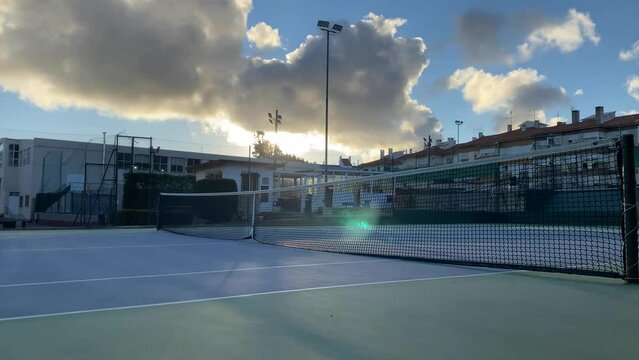 Sunrise timelapse in mountain. Big sun close-uo and clouds motion. Nature composition. View from tennis court.