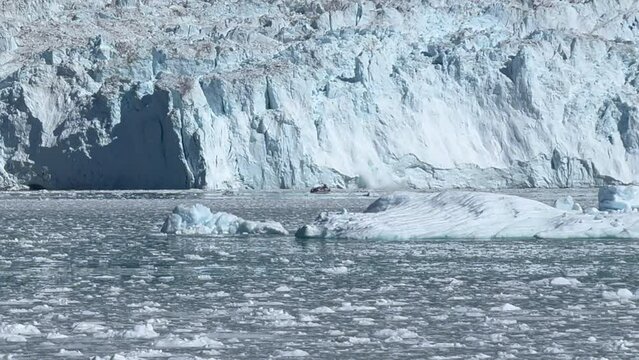 Closer look at a calving episode at the front of the Eqi Glacier (Eqip Sermia) outlet, north of the Disko Bay in Western Greenland. About 10 Km away from the massive Greenlandic Ice Cap
