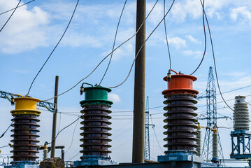 High voltage electric transformer.Electric current redistribution substation against the blue...