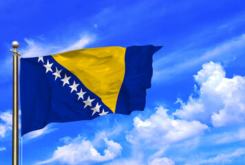 Bosnia National Flag Waving In The Wind On A Beautiful Summer Blue Sky