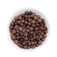 Black pepper in a white cup on a white background