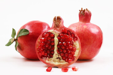 Red pomegranate on a white background. Shallow depth of field