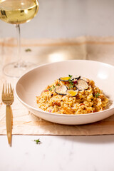 Homemade orzo risotto pasta with wild mushrooms, white wine, and  truffles