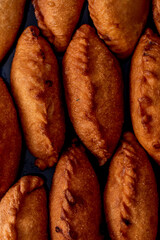moody close-up shot, top view of the deep-fried panzerotti dough