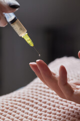 Doctor doing stem cell therapy on a patient's elbow after the injury. Treating knee pain with...