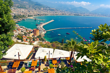 Beautiful view of Red Tower and Alanya Harbor in hot summer day.  Alanya, Antalya Province, Turkey