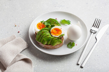 breakfast avocado sandwich with boiled egg