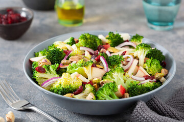 healthy broccoli salad with apple onion dried cranberries pistachio. vegan low carb diet