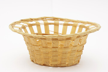 Vintage wicker fruit basket on a white background.