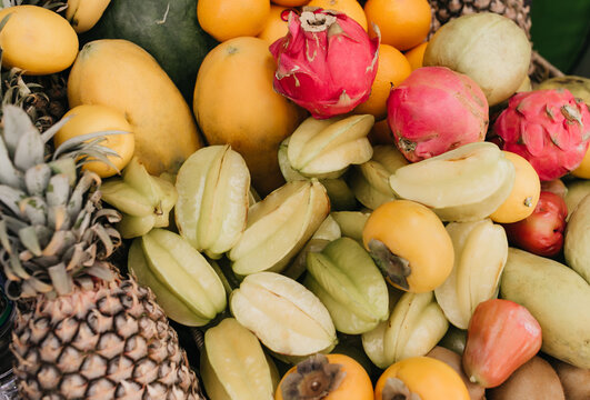 Picture of exotic fruits. Overhead photo of pineapple, carambola and other tropical food.