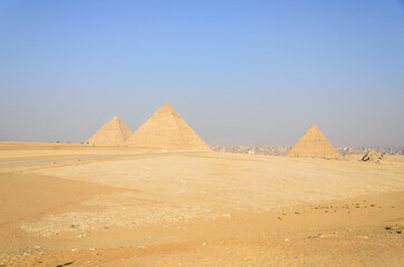 Fototapeta na wymiar Summer Pyramids of Giza on a sunny afternoon