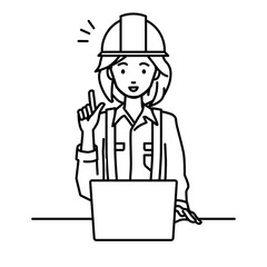 デスクで座ってPCを開いて何かひらめいた工事現場の女性