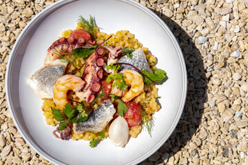 Ptitim pasta with seafood