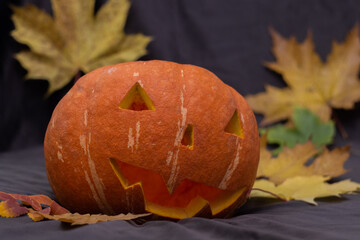 Pumpkin, close-up of dirty Jack-o-lantern. Orange decorative pumpkin. Halloween party concept.