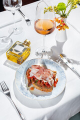 Bruschetta with prosciutto and tomatoes