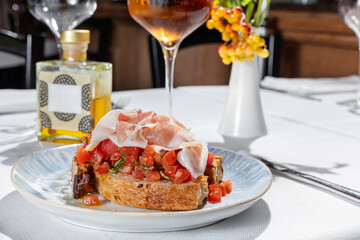 Bruschetta with prosciutto and tomatoes