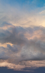Fantastic clouds at sunrise, vertical panorama