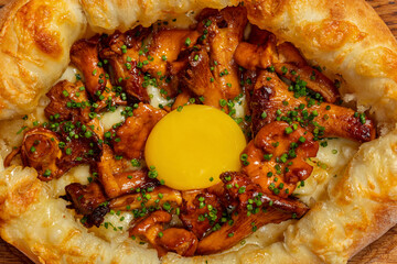 Adjarian khachapuri with fried chanterelle mushrooms.